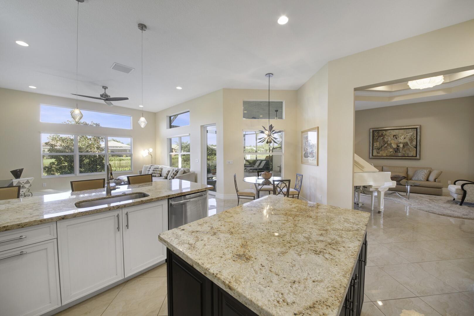 8289 Razorback Court Boynton Beach, FL 33473 - Photo 51 of 51 a kitchen with sink stove and cabinets