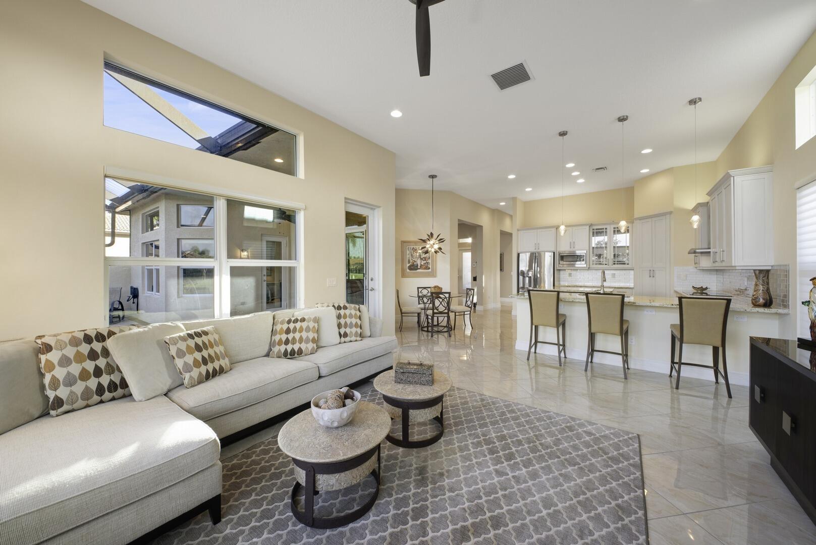 8289 Razorback Court Boynton Beach, FL 33473 - Photo 16 of 51 a living room with furniture and a large window