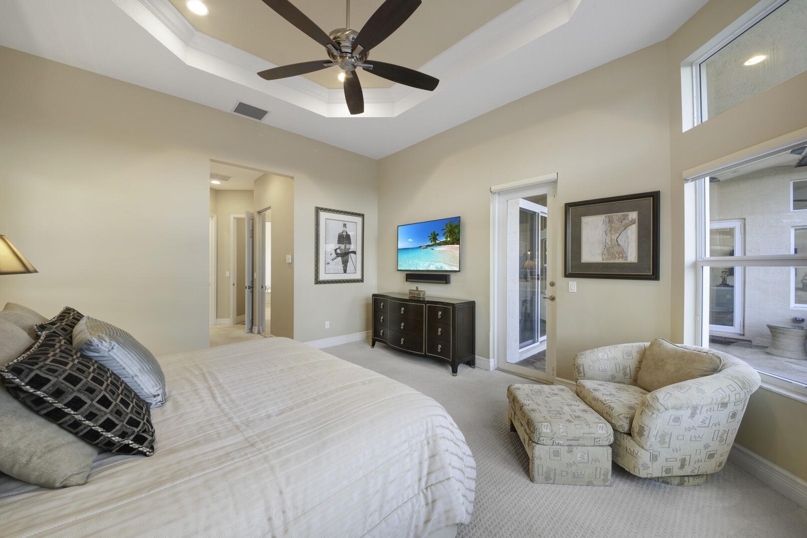 8289 Razorback Court Boynton Beach, FL 33473 - Photo 20 of 51 a bedroom with a bed and a chandelier