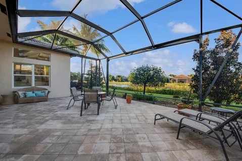 a view of a bench sitting in backyard of a house