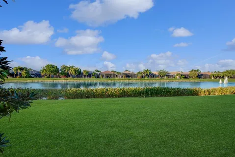 a view of a lake with houses in the background