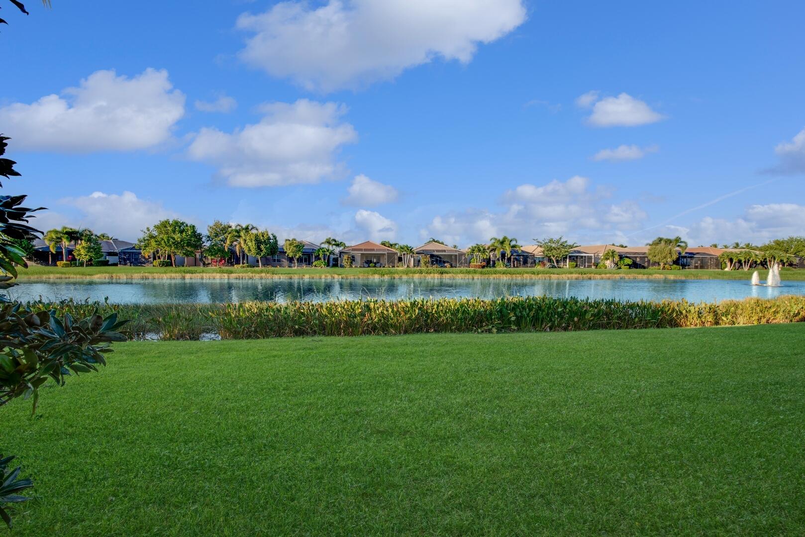 8289 Razorback Court Boynton Beach, FL 33473 - Photo 33 of 51 a view of a lake with houses in the background