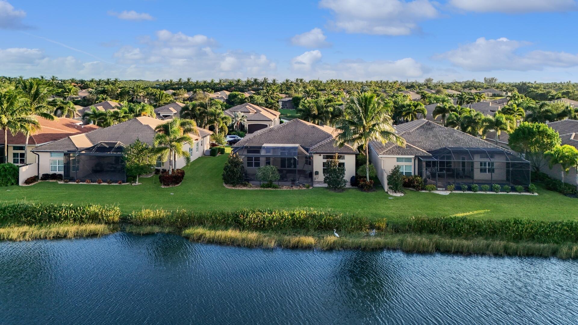 8289 Razorback Court Boynton Beach, FL 33473 - Photo 34 of 51 an aerial view of a house with a garden and lake view