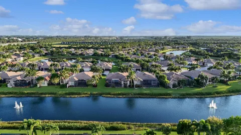 an aerial view of a city with lots of residential buildings and green space