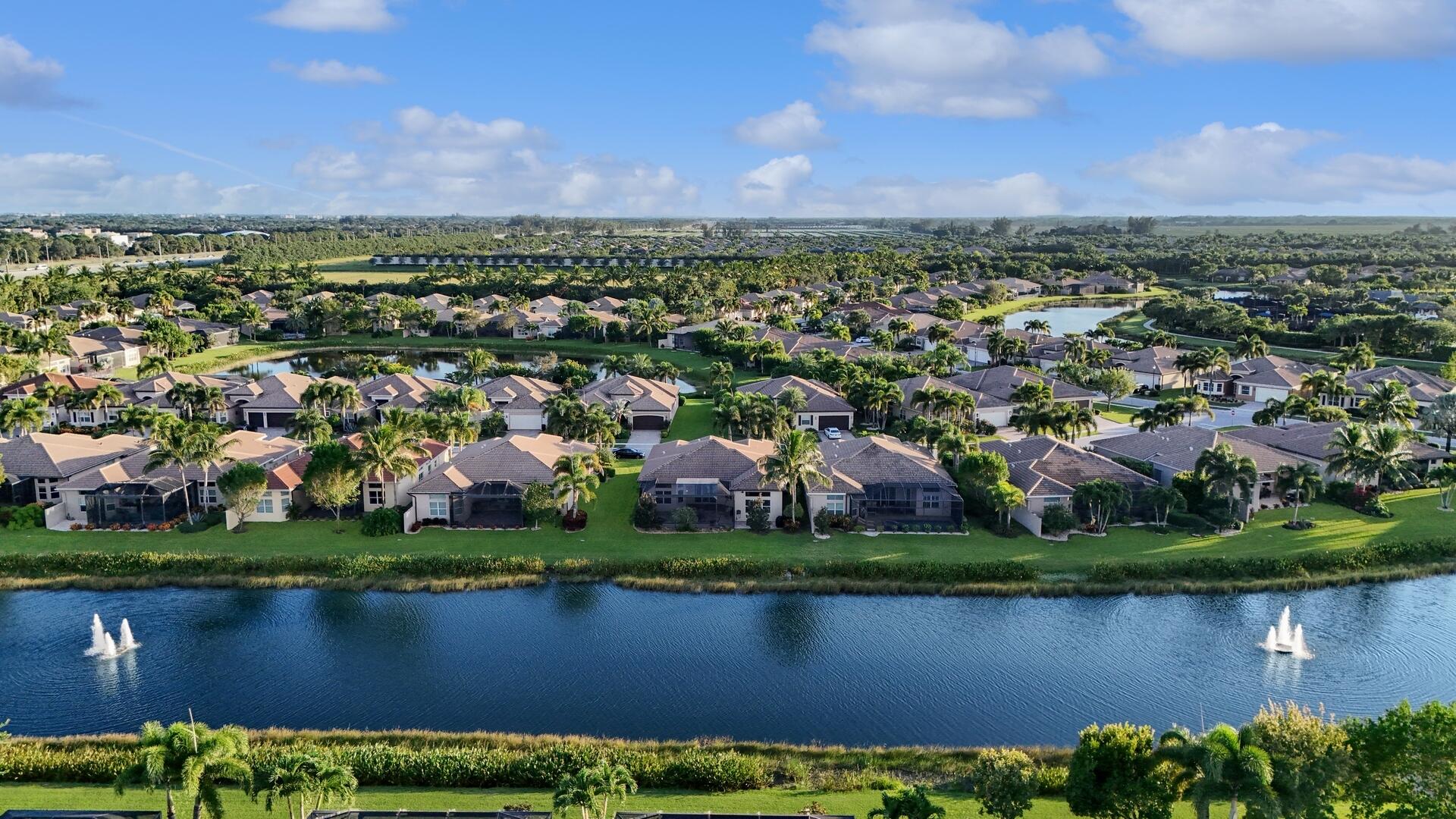8289 Razorback Court Boynton Beach, FL 33473 - Photo 37 of 51 an aerial view of a city with lots of residential buildings and green space