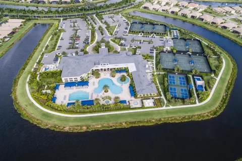 a view of swimming pool with a bathtub and seating space