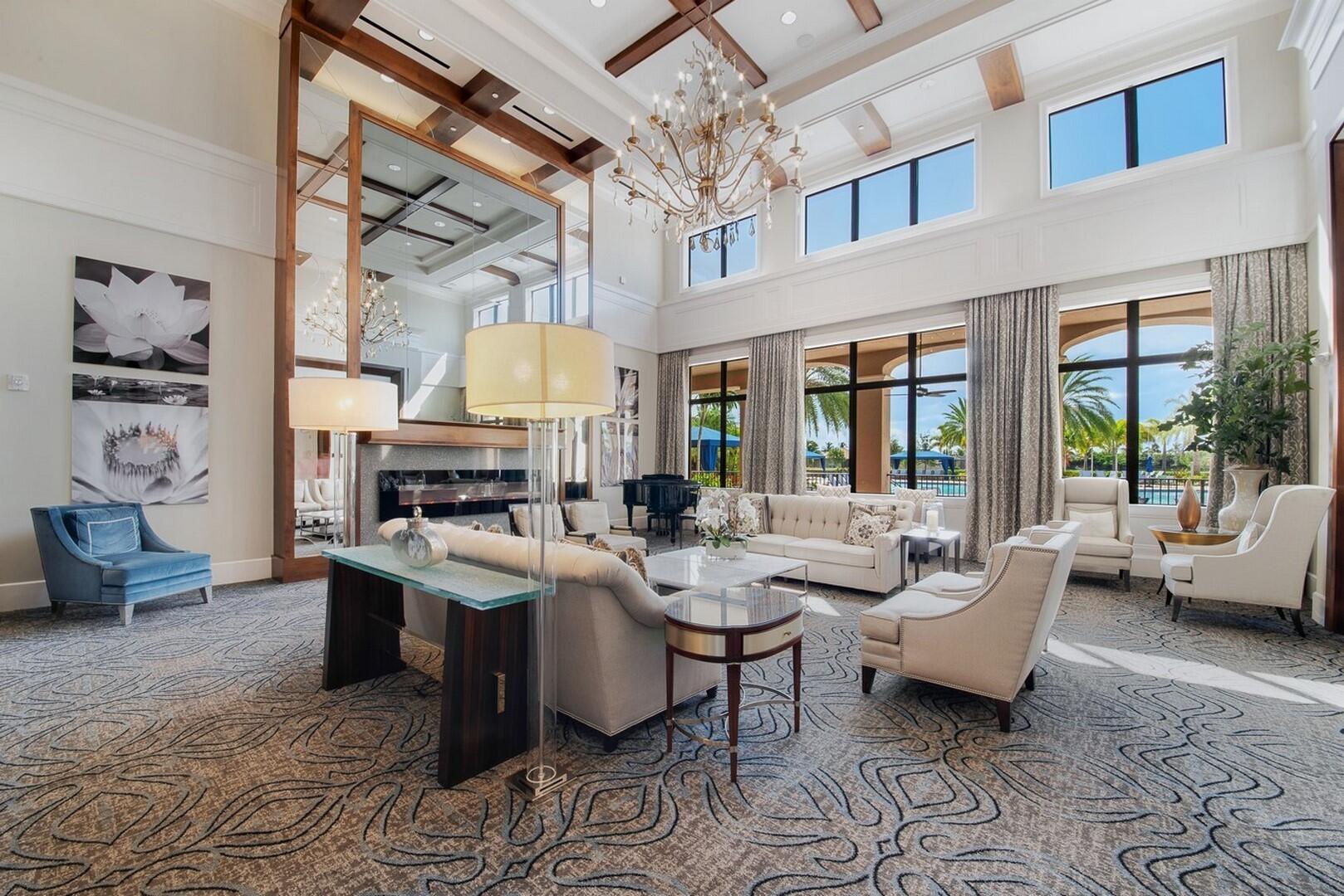 8289 Razorback Court Boynton Beach, FL 33473 - Photo 45 of 51 a living room with fireplace furniture and a large window
