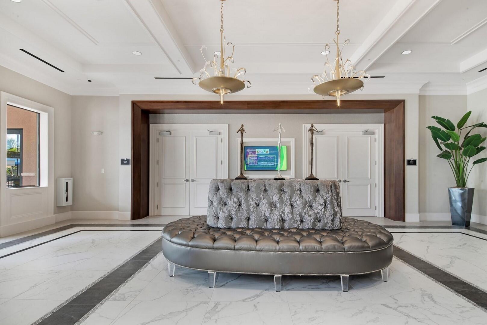 8289 Razorback Court Boynton Beach, FL 33473 - Photo 46 of 51 a living room with furniture and a chandelier