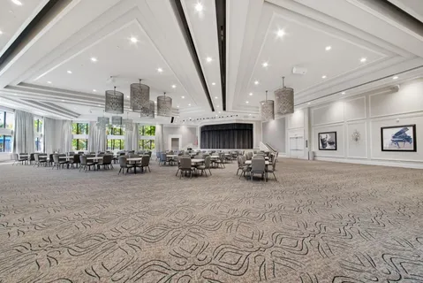 a view of a lobby with furniture and floor to ceiling window