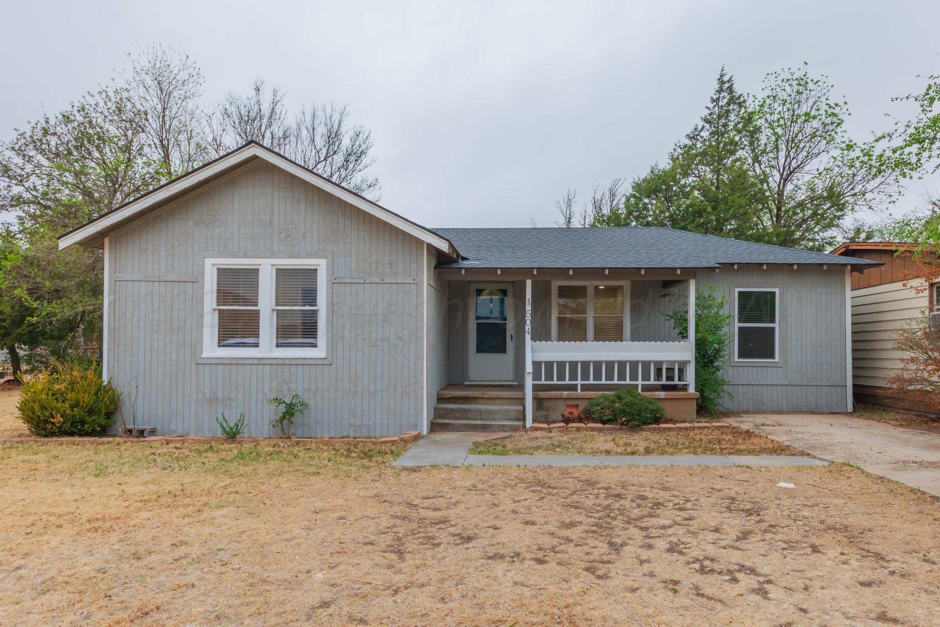 504 High Street Claude, TX 79019 - Photo 1 of 39 a front view of a house with garden