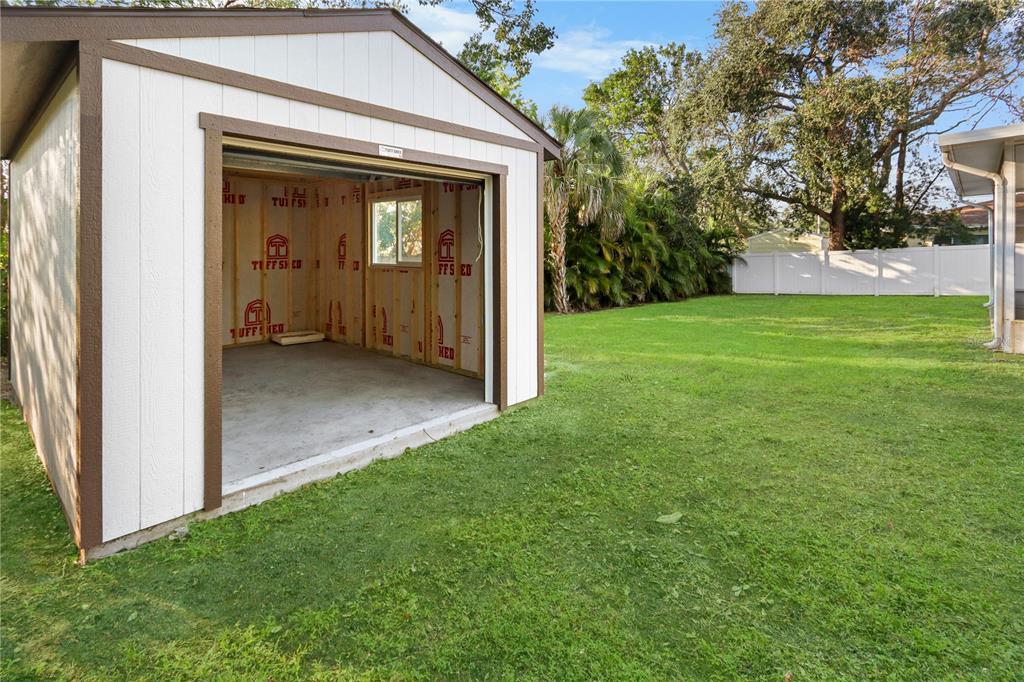 772 Palmer Road Belleair Bluffs, FL 33770 - Photo 2 of 26 a view of a front view of a house with a yard