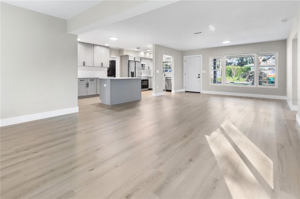 772 Palmer Road Belleair Bluffs, FL 33770 - Photo 5 of 26 a view of a kitchen with wooden floor and windows