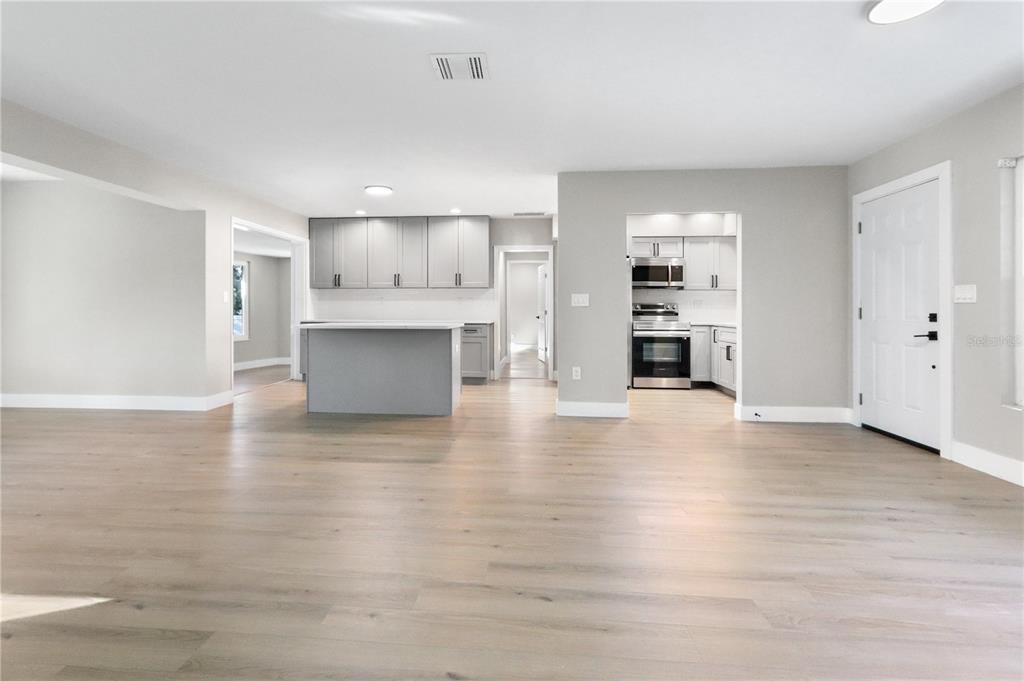 772 Palmer Road Belleair Bluffs, FL 33770 - Photo 6 of 26 a view of kitchen with furniture and wooden floor