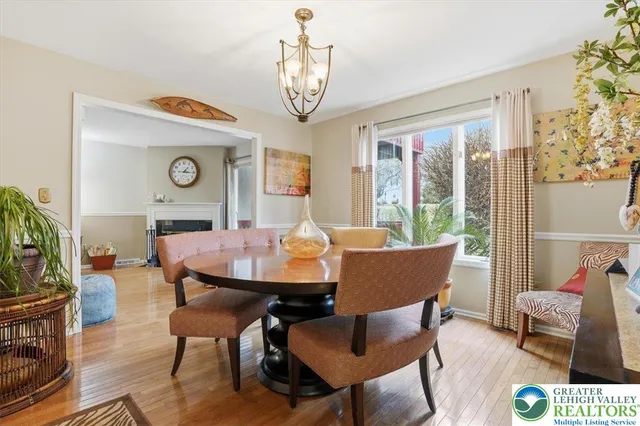 a kitchen with stainless steel appliances kitchen island granite countertop a refrigerator and a sink