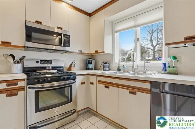 a view of a livingroom with furniture and a flat screen tv