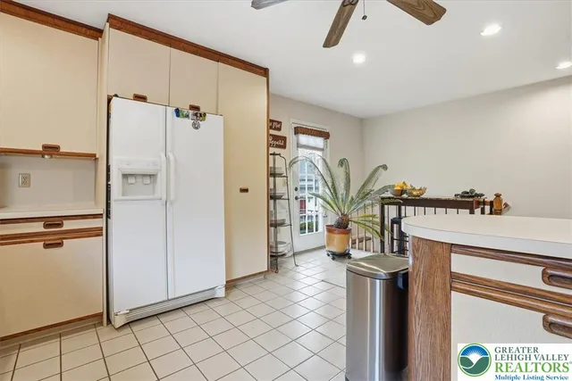 a bathroom with a granite countertop sink a toilet and a mirror