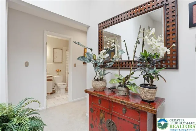 a bedroom with a bed and flat screen tv