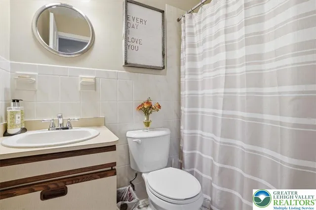 a bedroom with a bed and flat screen tv