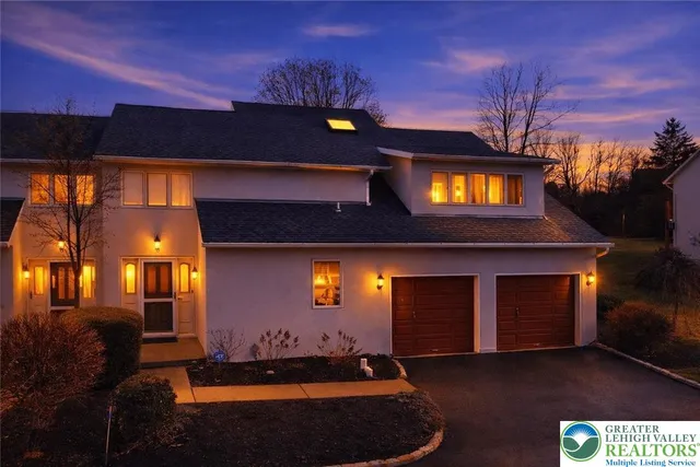 a living room with furniture a fireplace and window
