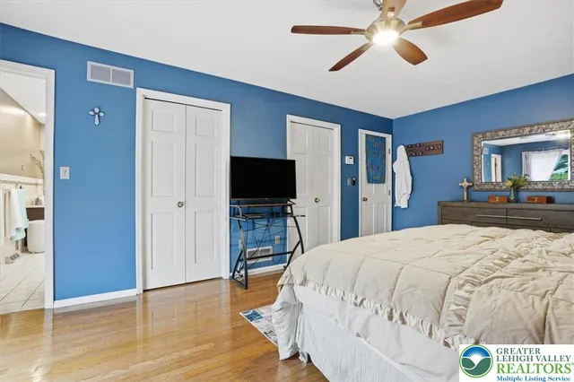 a aerial view of a house with swimming pool and a yard