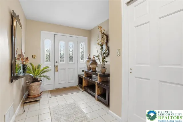 a living room with furniture flat screen tv and a fireplace