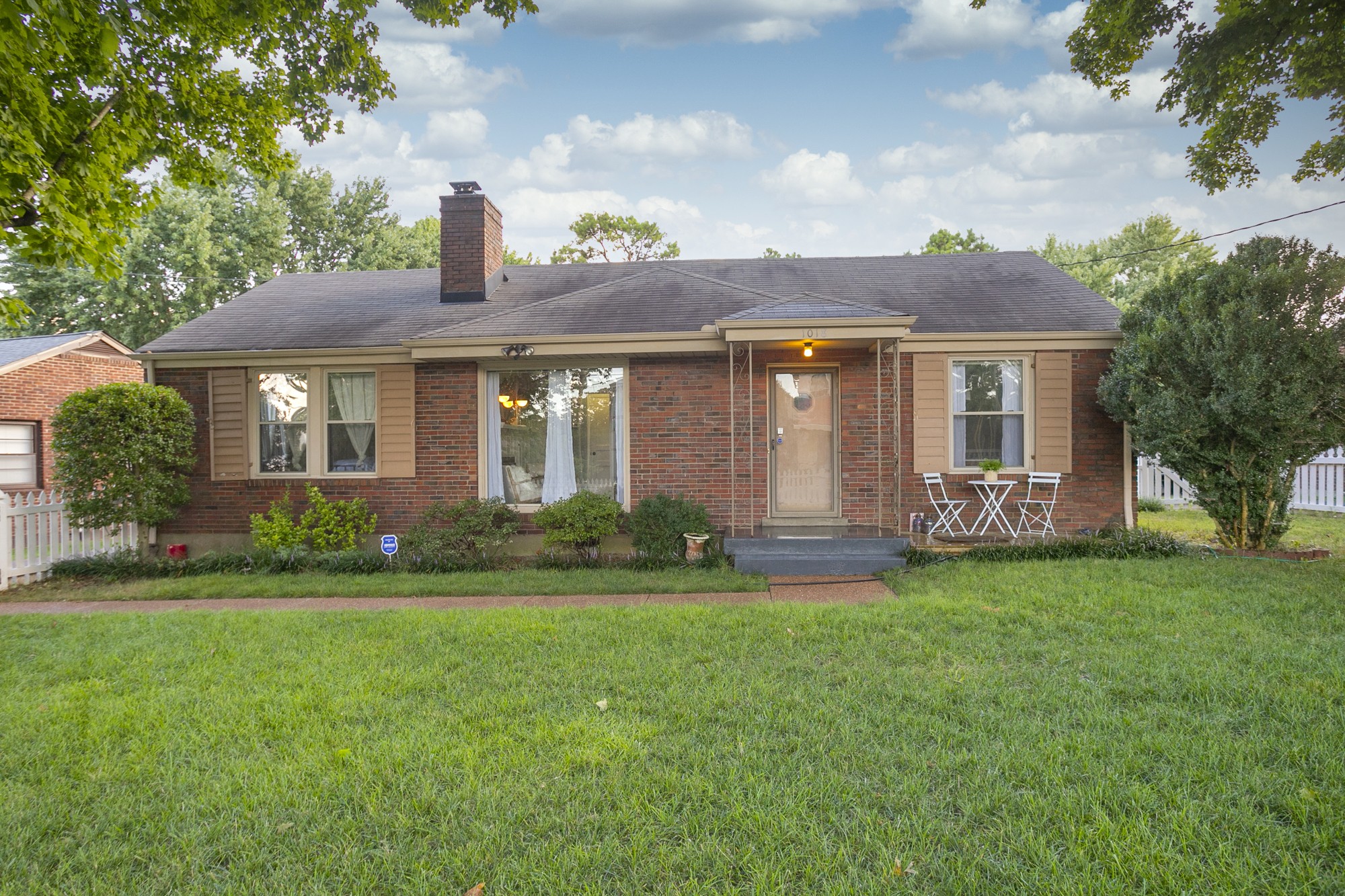 1018 Mitchell Road Nashville, TN 37206 - Photo 1 of 44 a front view of a house with a garden