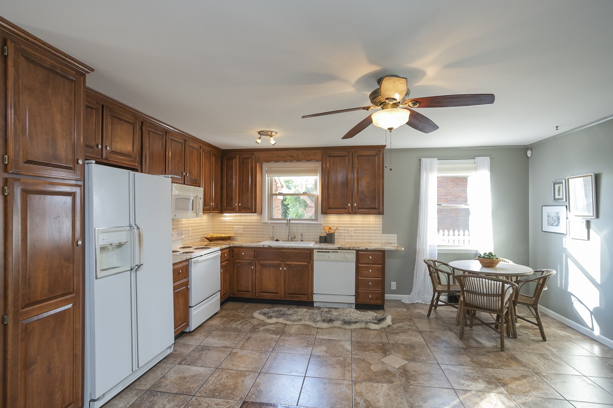 1018 Mitchell Road Nashville, TN 37206 - Photo 11 of 44 a kitchen with refrigerator cabinets and windows