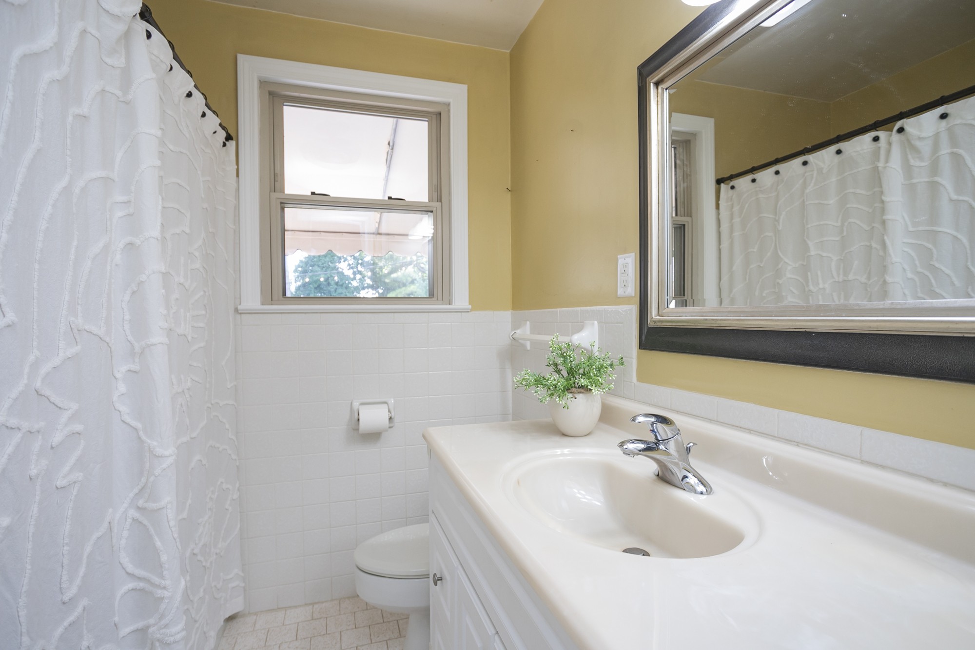 1018 Mitchell Road Nashville, TN 37206 - Photo 27 of 44 a bathroom with a granite countertop sink toilet and mirror