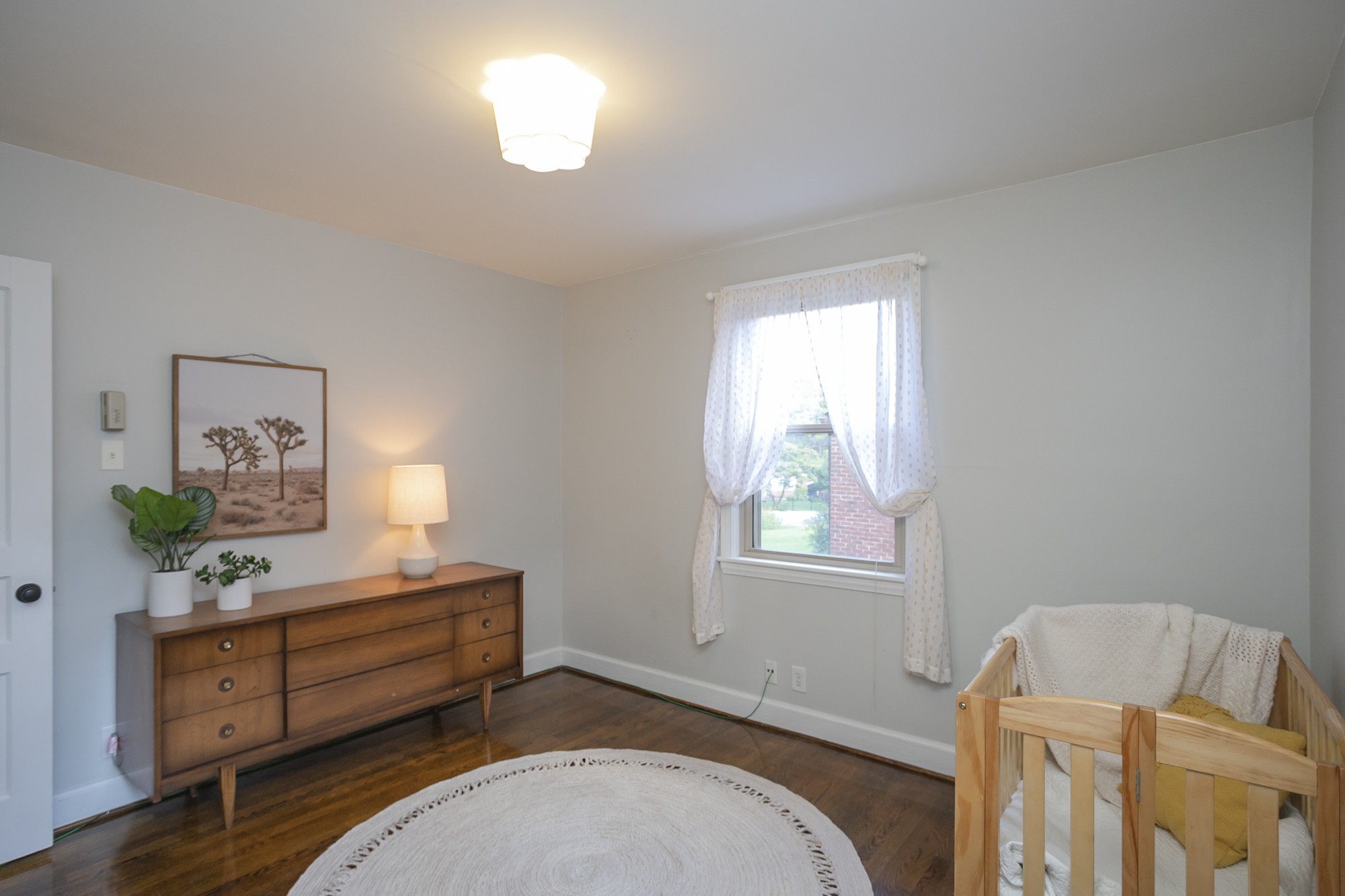 1018 Mitchell Road Nashville, TN 37206 - Photo 29 of 44 a spacious bedroom with a bed and a window