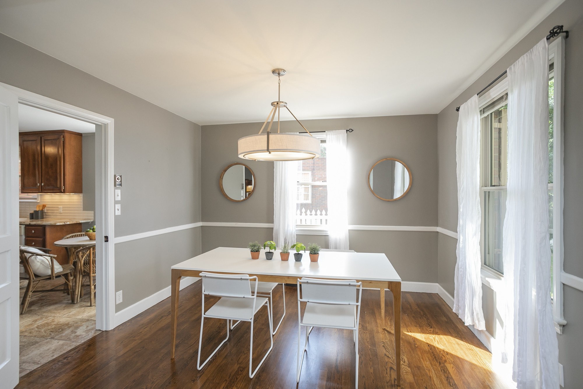 1018 Mitchell Road Nashville, TN 37206 - Photo 7 of 44 a view of a dining room with furniture window and wooden floor