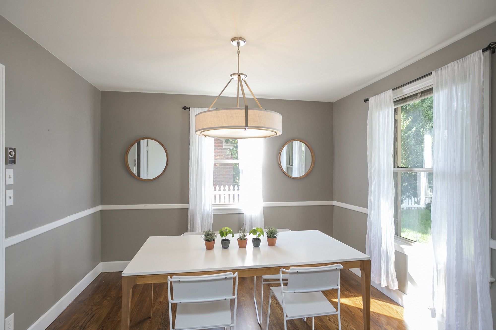 1018 Mitchell Road Nashville, TN 37206 - Photo 8 of 44 a view of a dining room with furniture window and wooden floor