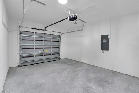 a view of an empty room with a ceiling fan