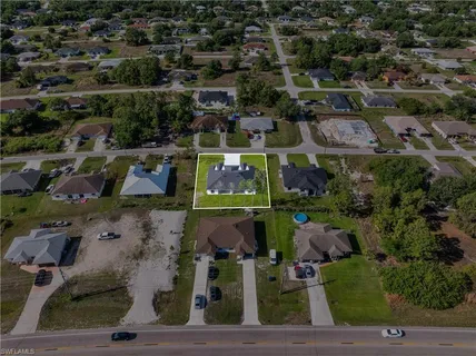 an aerial view of houses with outdoor space