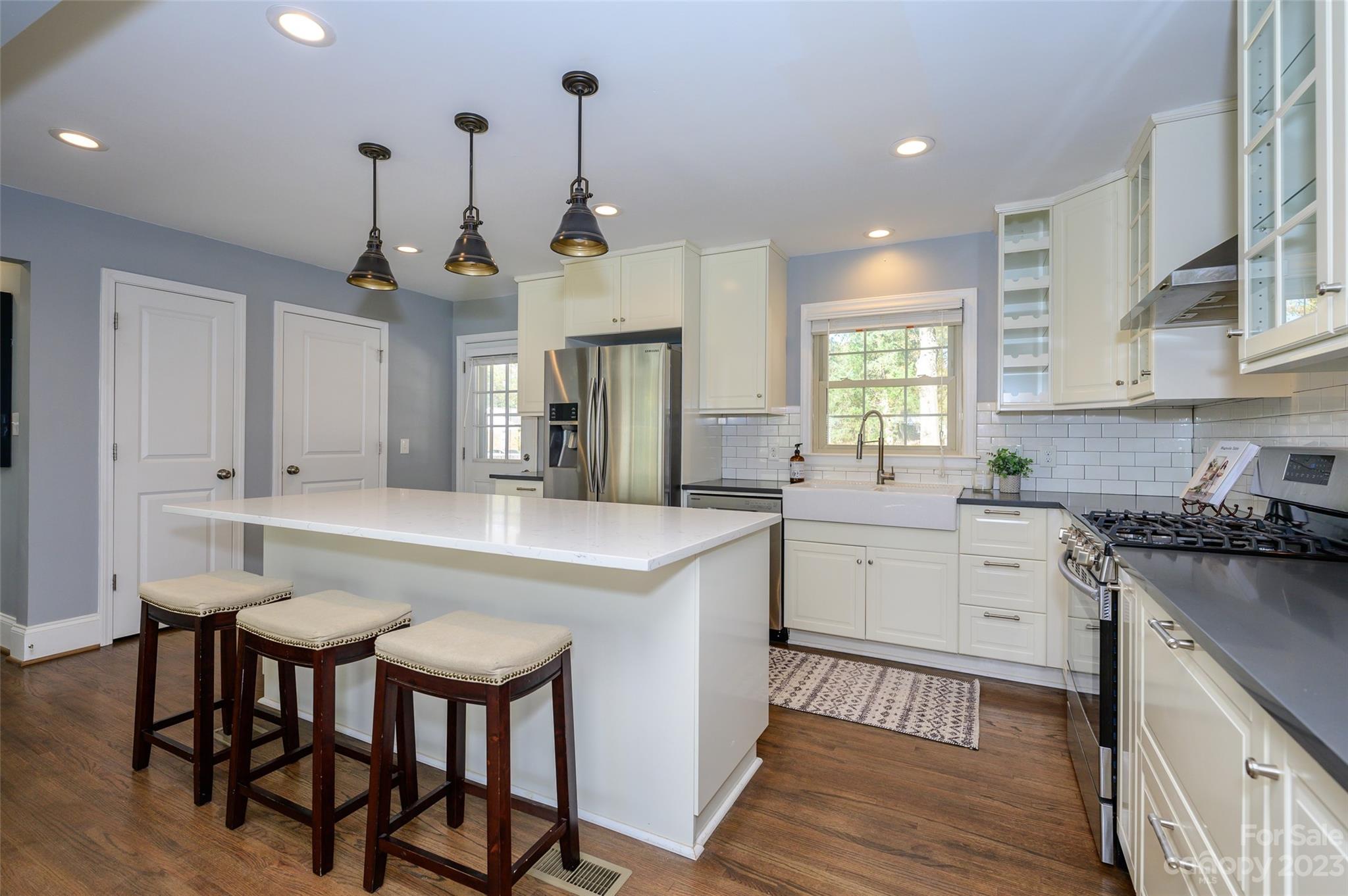 2901 Enfield Road Charlotte, NC 28205 - Photo 12 of 29 a kitchen with a table chairs stove and cabinets