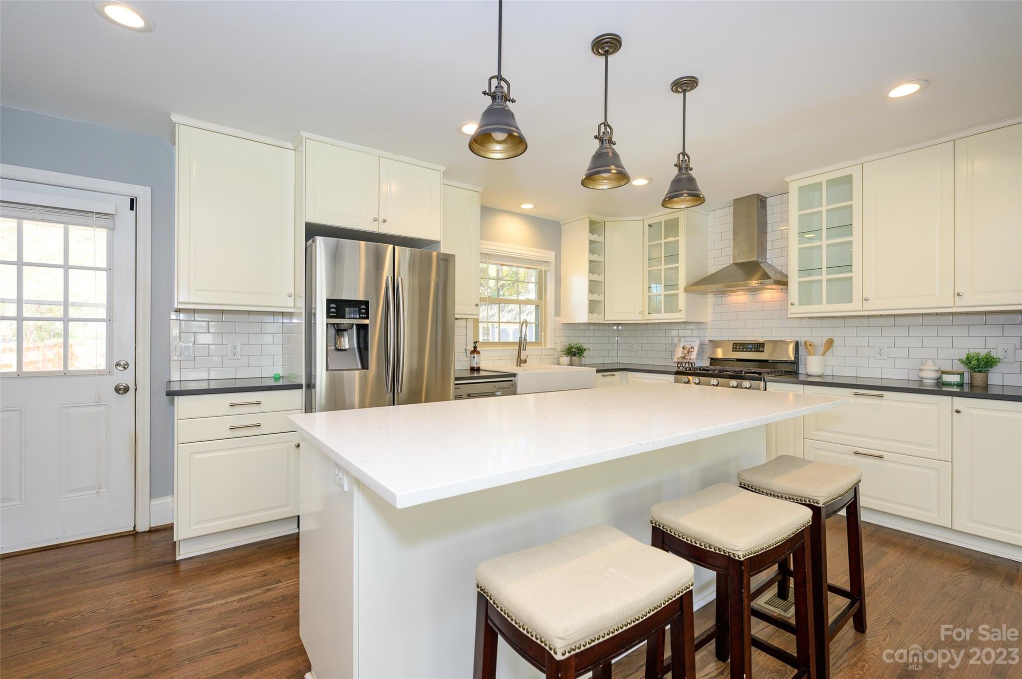 2901 Enfield Road Charlotte, NC 28205 - Photo 15 of 29 a large kitchen with a table and chairs