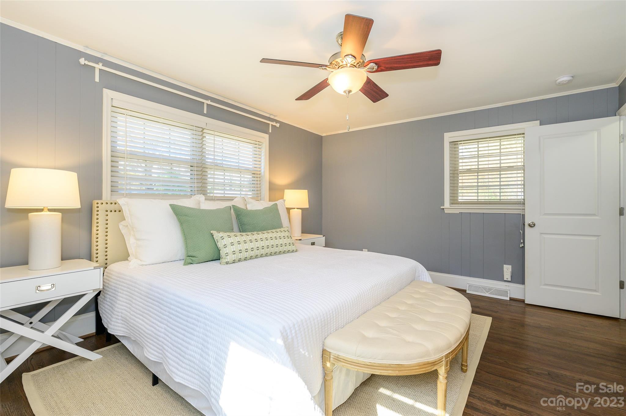 2901 Enfield Road Charlotte, NC 28205 - Photo 17 of 29 a bedroom with a bed and a chandelier