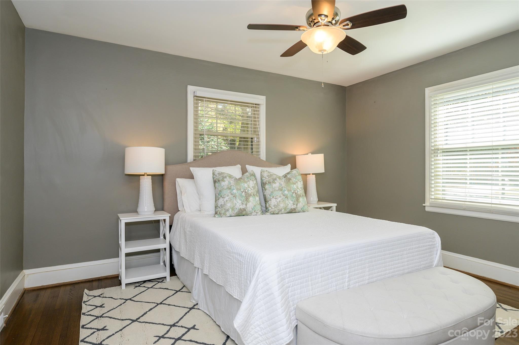 2901 Enfield Road Charlotte, NC 28205 - Photo 20 of 29 a bedroom with a bed and a lamp