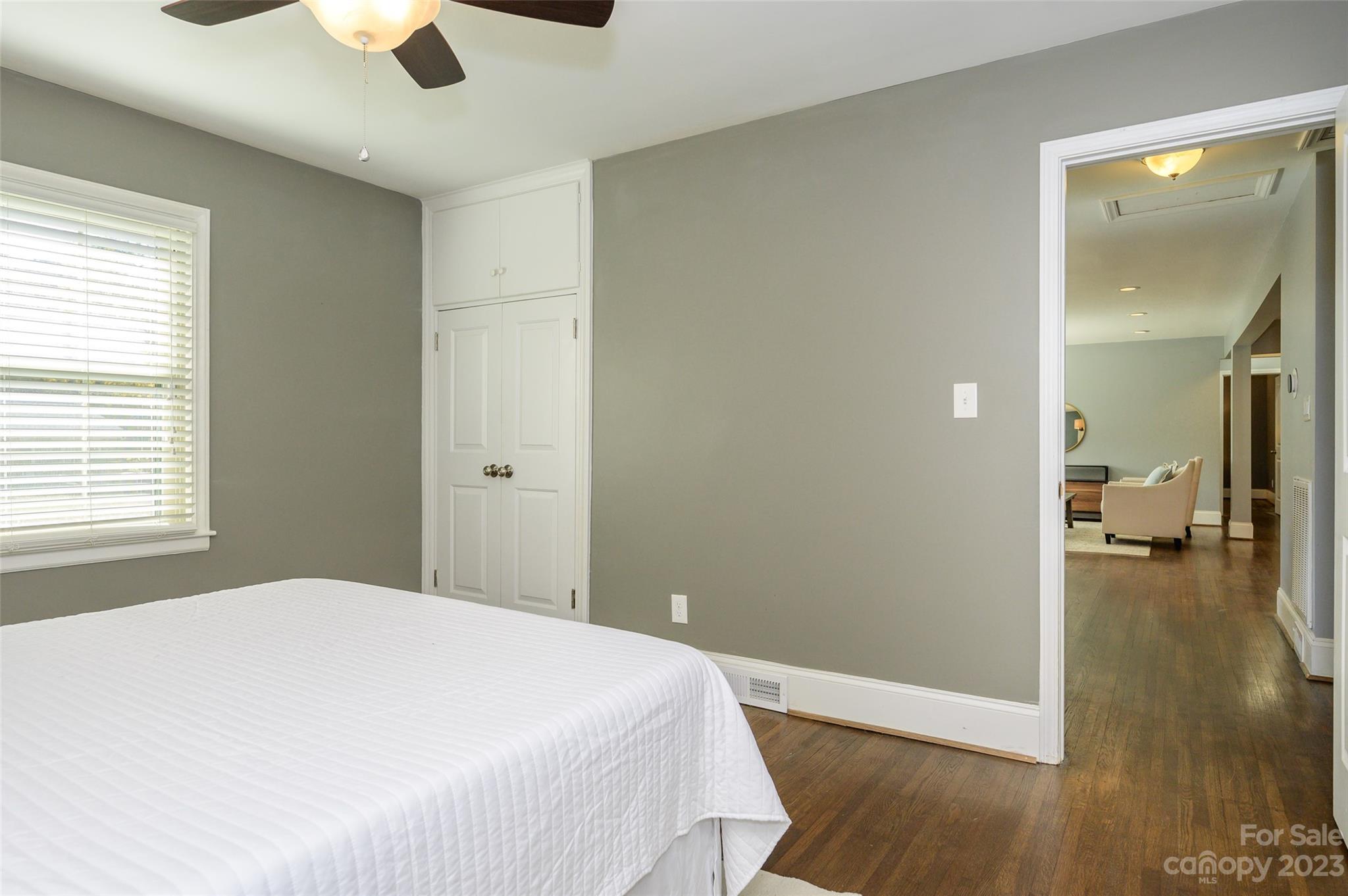 2901 Enfield Road Charlotte, NC 28205 - Photo 21 of 29 a bedroom with a bed and a chandelier