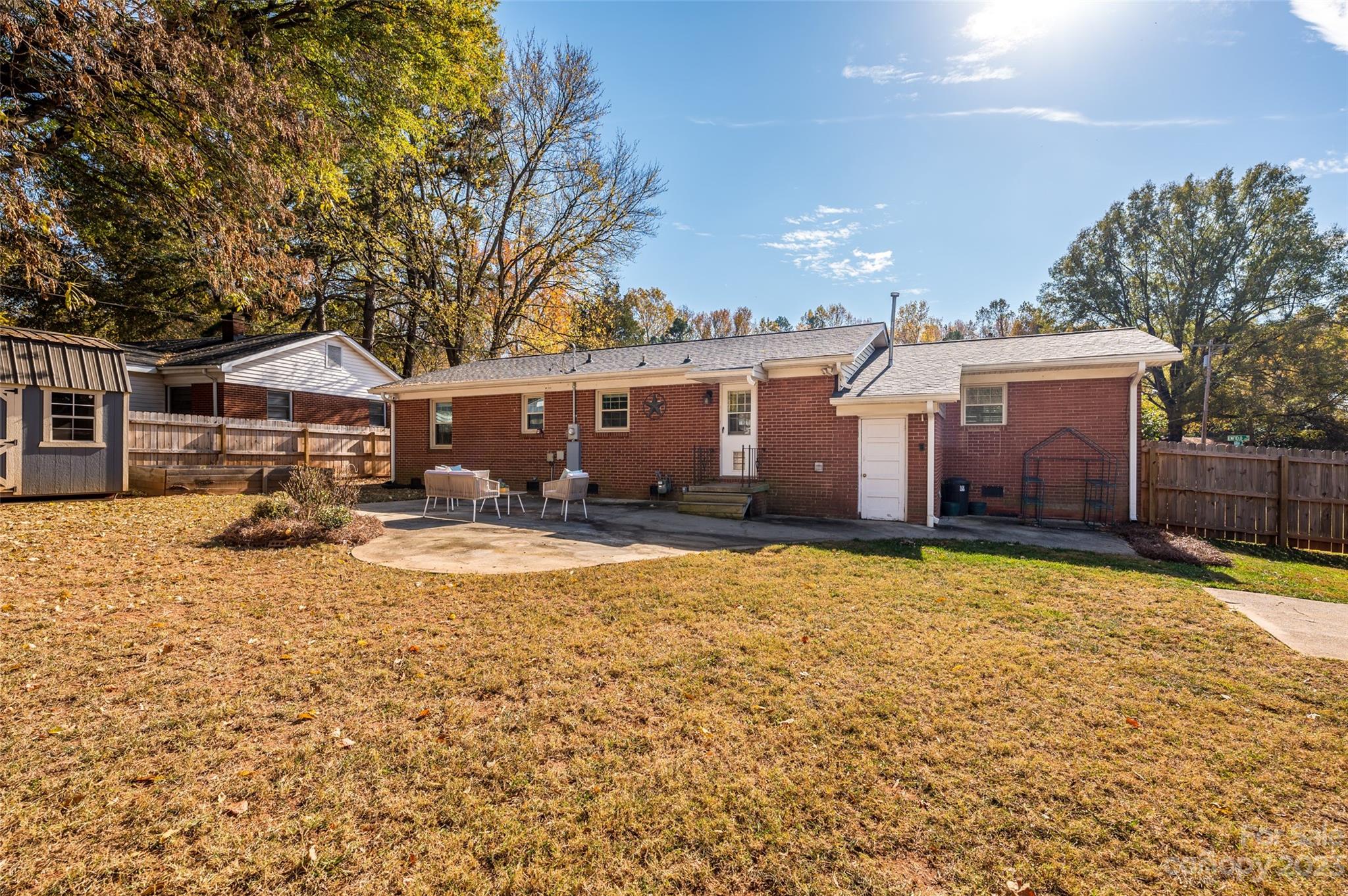 2901 Enfield Road Charlotte, NC 28205 - Photo 27 of 29 a front view of a house with a yard covered with snow and trees