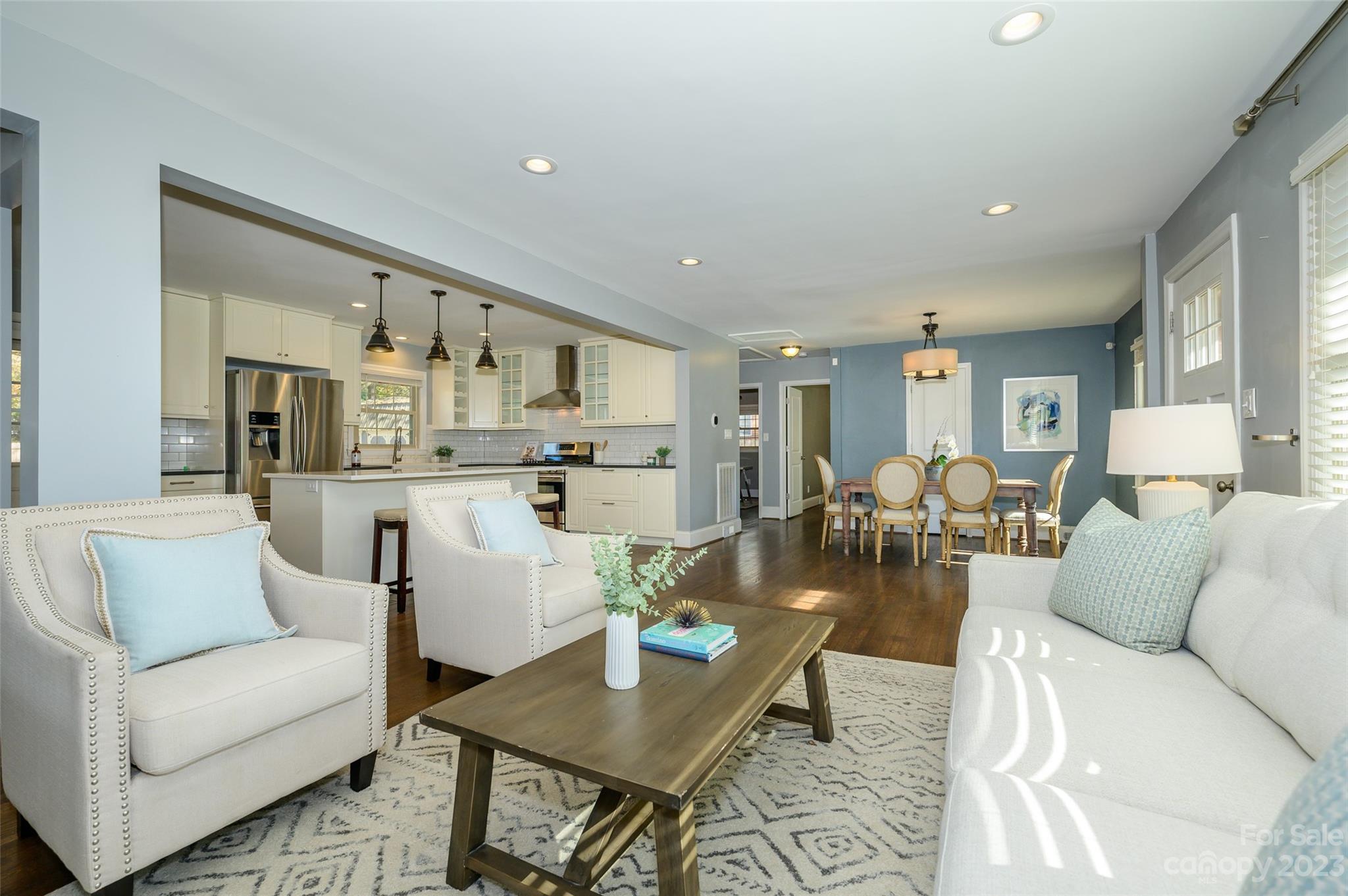 2901 Enfield Road Charlotte, NC 28205 - Photo 7 of 29 a living room with furniture white walls and kitchen view
