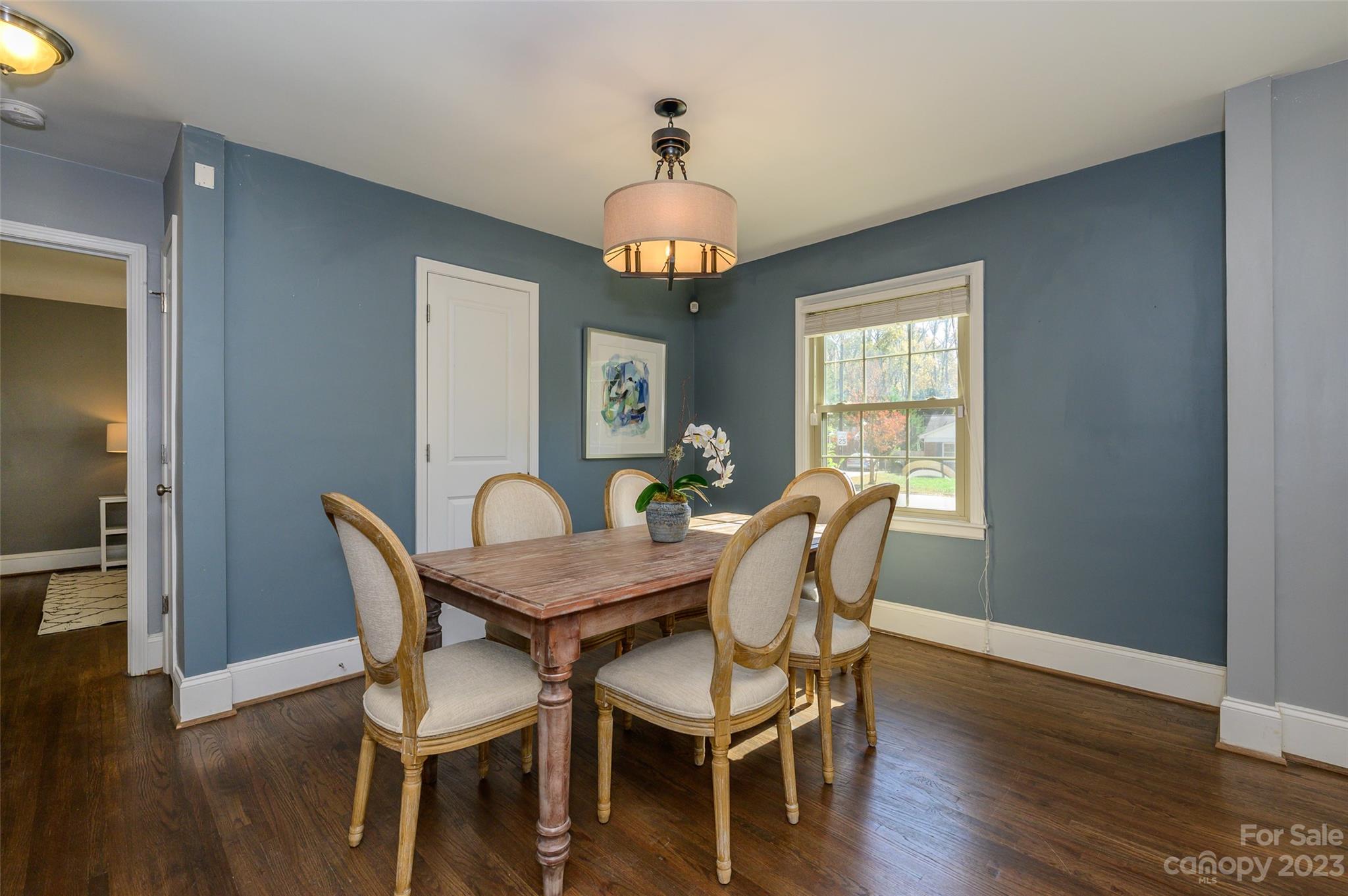 2901 Enfield Road Charlotte, NC 28205 - Photo 8 of 29 a view of a dining room with furniture wooden floor and chandelier