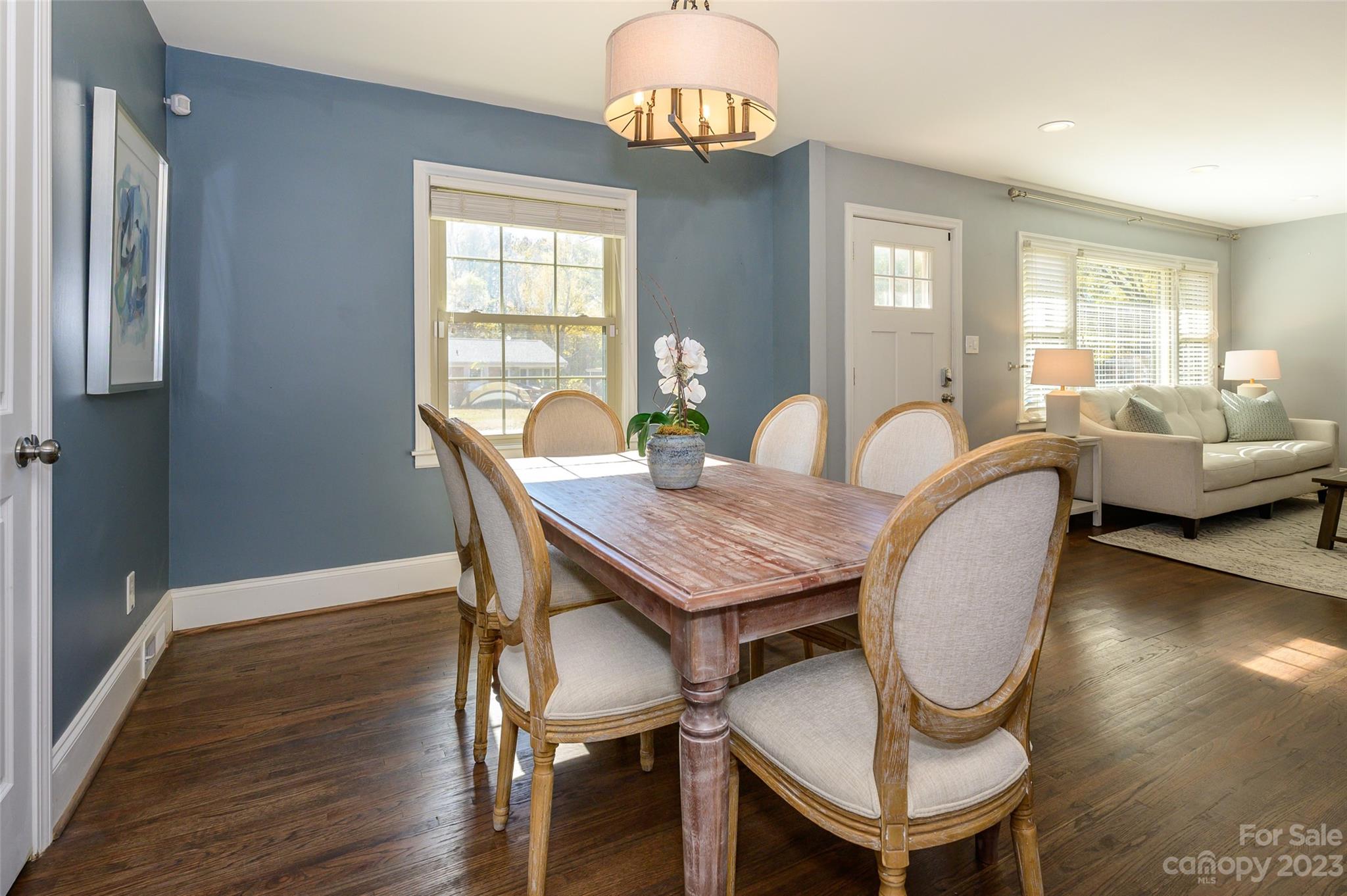 2901 Enfield Road Charlotte, NC 28205 - Photo 9 of 29 a view of a dining room with furniture window and wooden floor