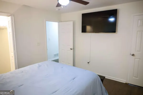 a bathroom with a toilet a sink and shower