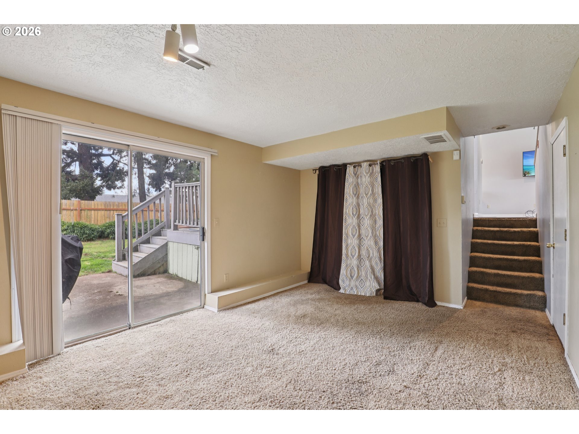 691 Southwest Linneman Court Gresham, OR 97030 - Photo 16 of 35 a view of a livingroom with furniture and staircase