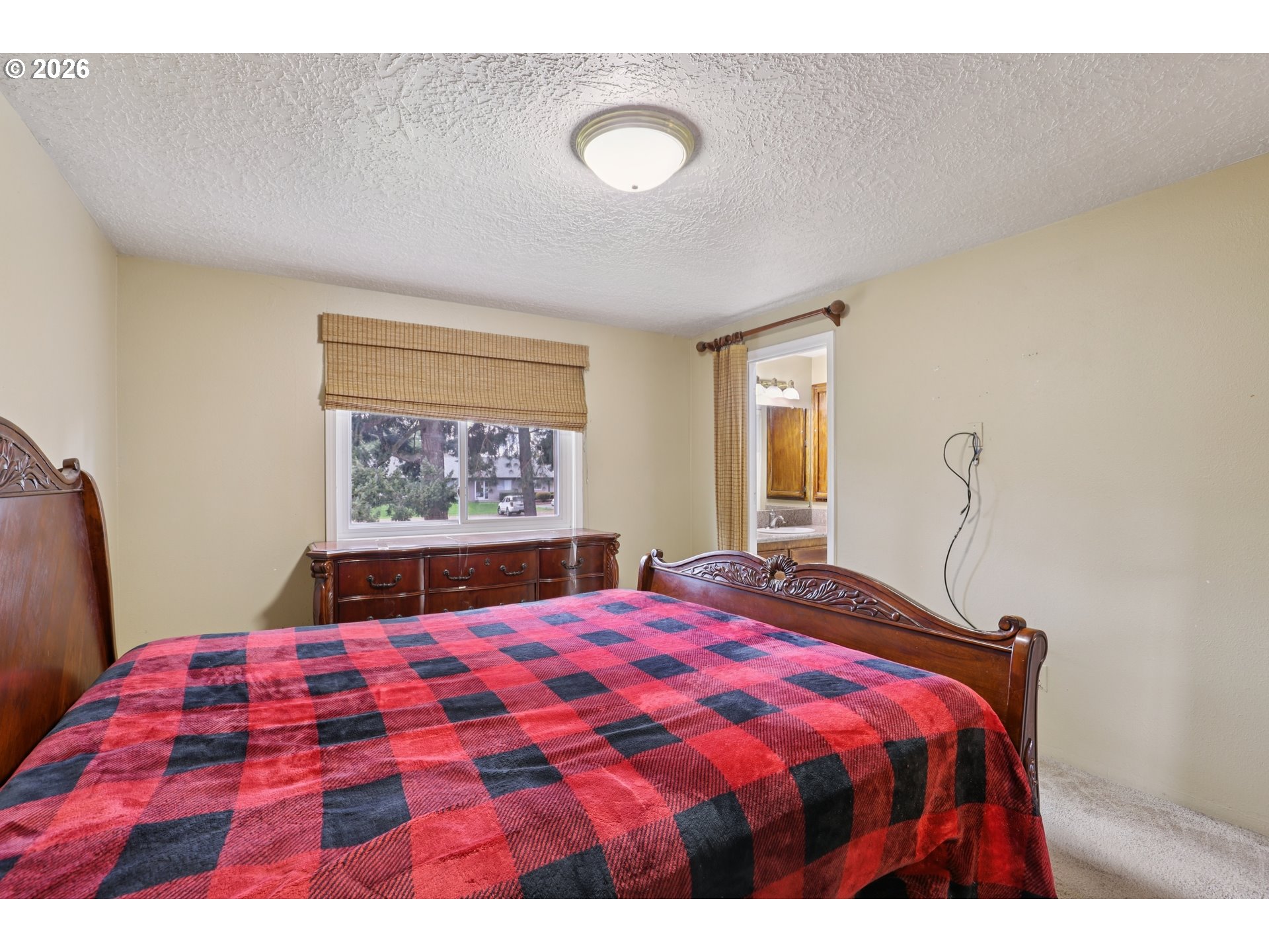 691 Southwest Linneman Court Gresham, OR 97030 - Photo 17 of 35 a bedroom with a bed and a window