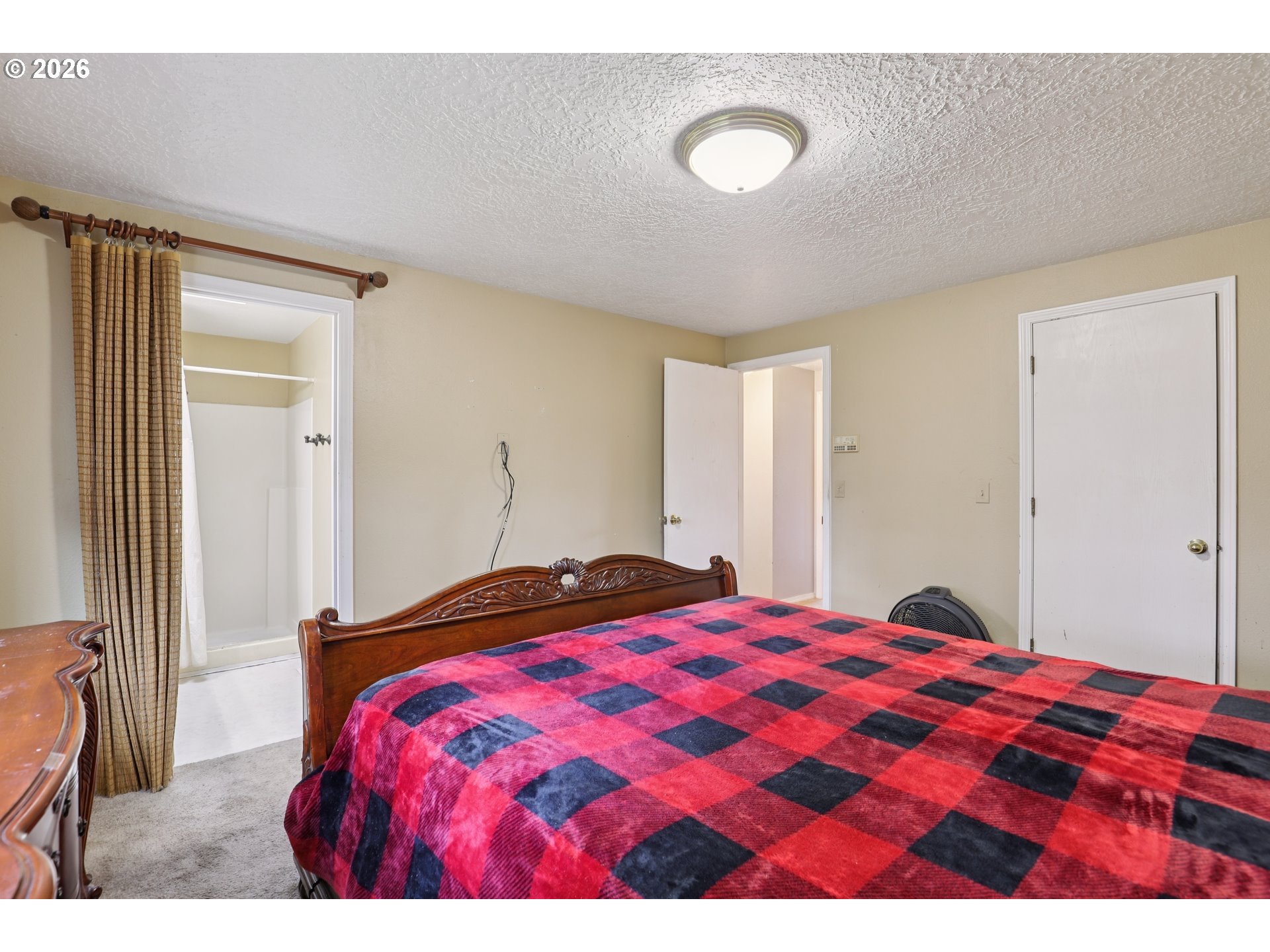 691 Southwest Linneman Court Gresham, OR 97030 - Photo 18 of 35 a bedroom with a bed and a lamp