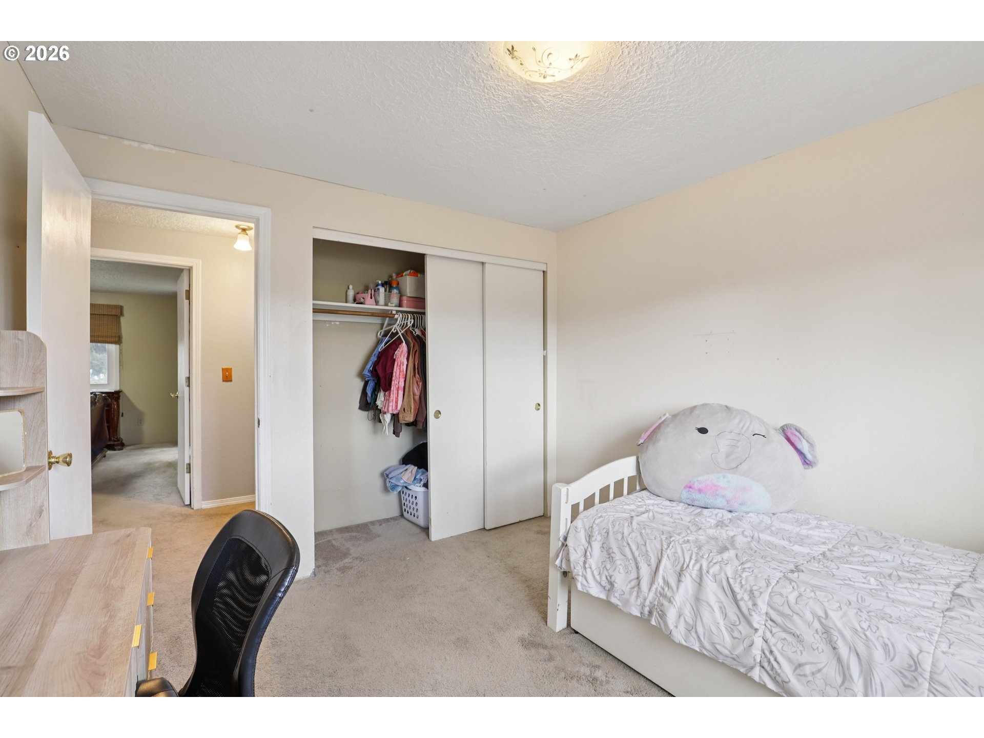 691 Southwest Linneman Court Gresham, OR 97030 - Photo 21 of 35 a bedroom with a bed and a closet