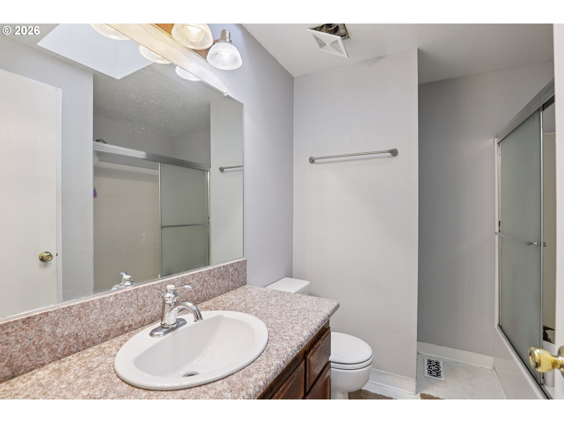 691 Southwest Linneman Court Gresham, OR 97030 - Photo 22 of 35 a bathroom with a granite countertop sink toilet and shower