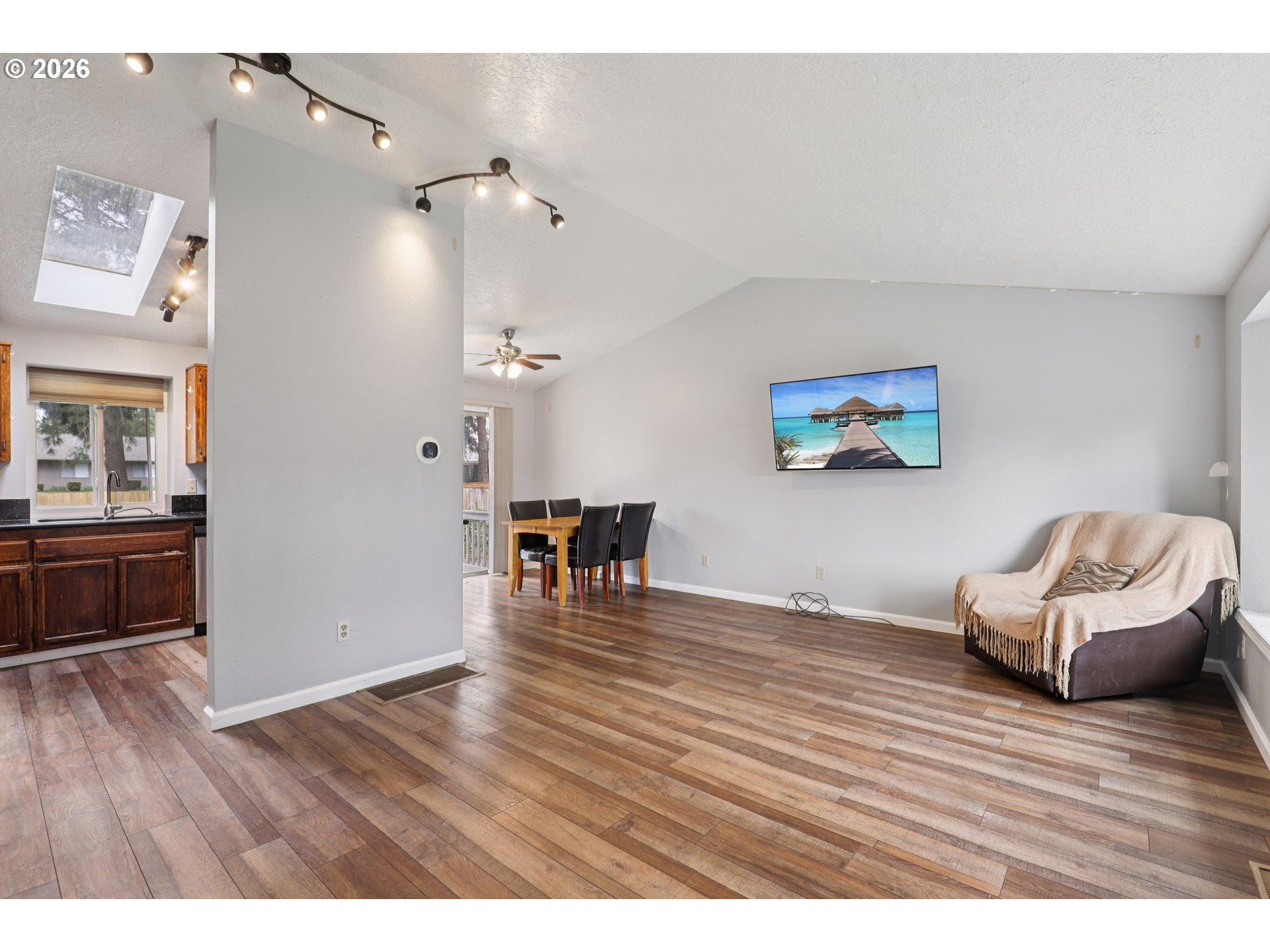 691 Southwest Linneman Court Gresham, OR 97030 - Photo 5 of 35 a view interior of livingroom and dining room with wooden floor