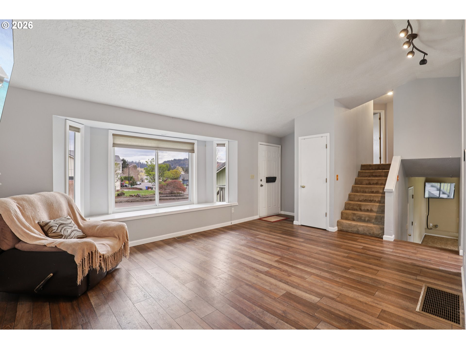 691 Southwest Linneman Court Gresham, OR 97030 - Photo 7 of 35 a living room with furniture and a large window